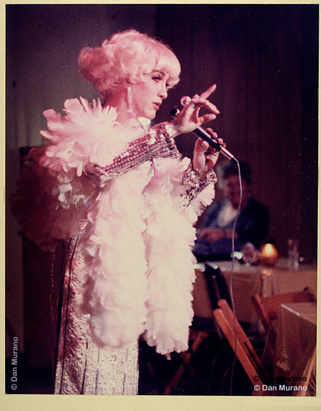 Kevin Bossolono as Carol Channing during a performance at the Home Circle Club. Scan from vintage print.